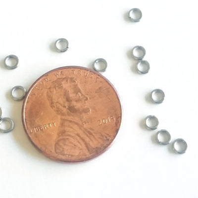 3mm jump rings compared to a penny