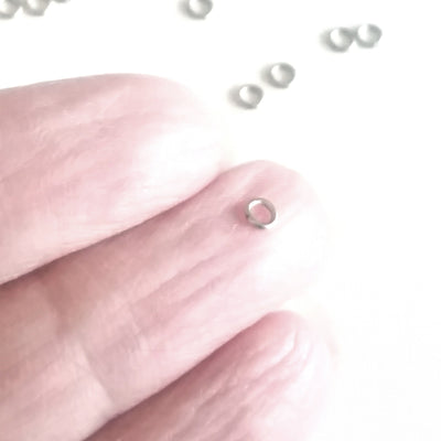 3mm jump rings compared to a finger tip