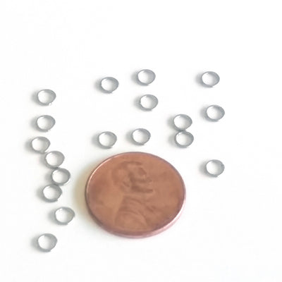 4mm jump rings next to a penny.