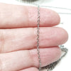 Chain draped over fingers for size comparasion